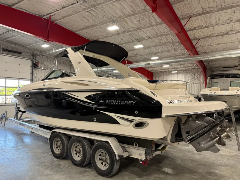 Slide: The Image of 2007 Monterey 298 boat on trailer in indoor storage facility. - 3