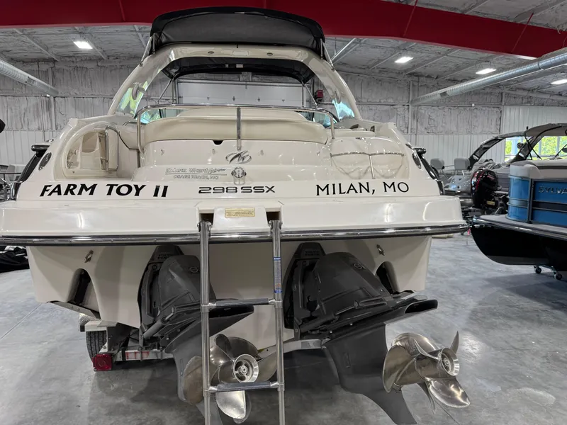 Slide: The Image of 2007 Monterey 298 boat in a warehouse, rear view with dual propellers. - 5