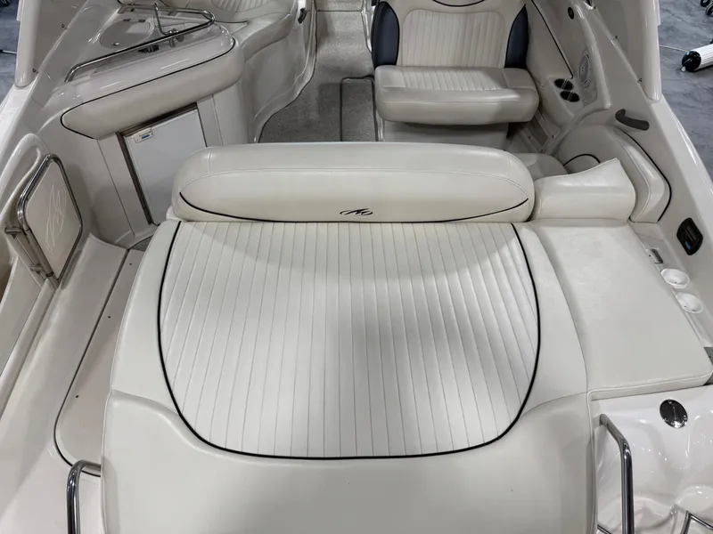 Slide: The Image of 2007 Monterey 298 boat interior with white leather seating and sleek design. - 6