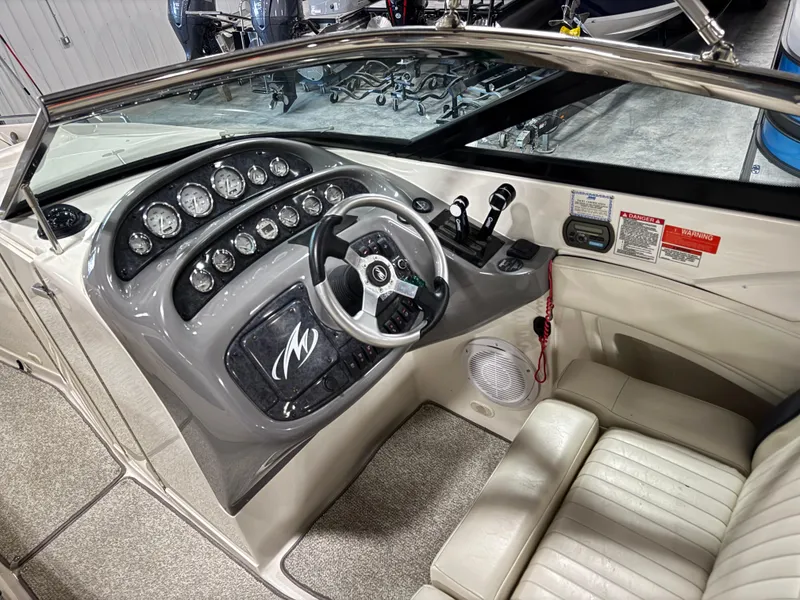 Slide: The Image of 2007 Monterey 298 boat dashboard with steering wheel and instrument panel. - 9