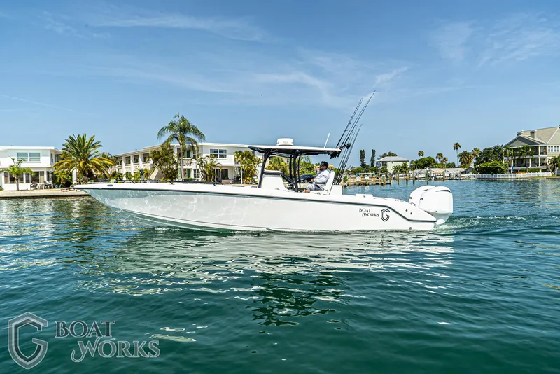 Slide: The Image of 2022 CG Boat Works 35 M-Series cruising on a sunny waterfront. - 13