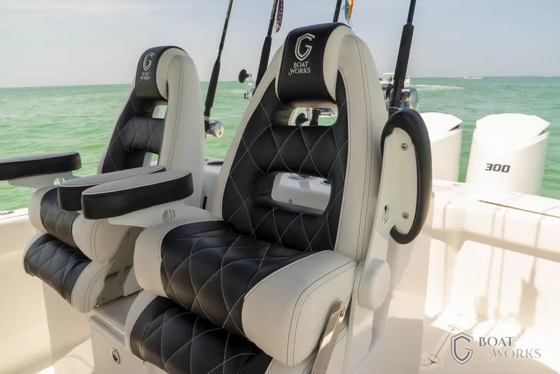 Slide: The Image of Luxury seating on 2022 CG Boat Works 35 M-Series, featuring black and white upholstery. - 24