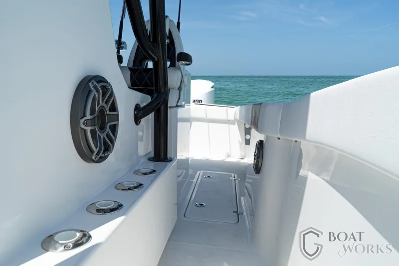 Slide: The Image of 2022 CG Boat Works 35 M-Series deck, featuring sleek design and ocean backdrop. - 31