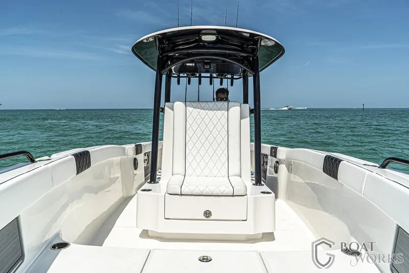 Slide: The Image of 2022 CG Boat Works 35 M-Series on open water, featuring sleek design and luxury seating. - 32