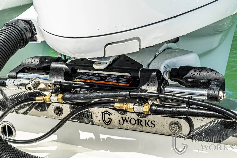 Slide: The Image of CG Boat Works 35 M-Series 2022 engine detail with hydraulic components and branding. - 35