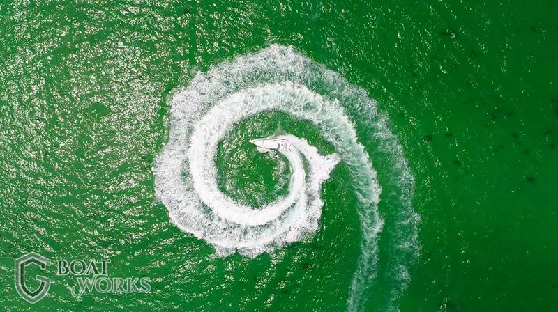 Slide: The Image of Aerial view of 2022 CG Boat Works 35 M-Series creating spiral wake pattern. - 36