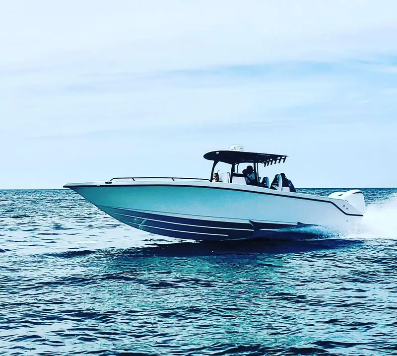 Slide: The Image of 2022 CG Boat Works 35 M-Series cruising on open water. - 39