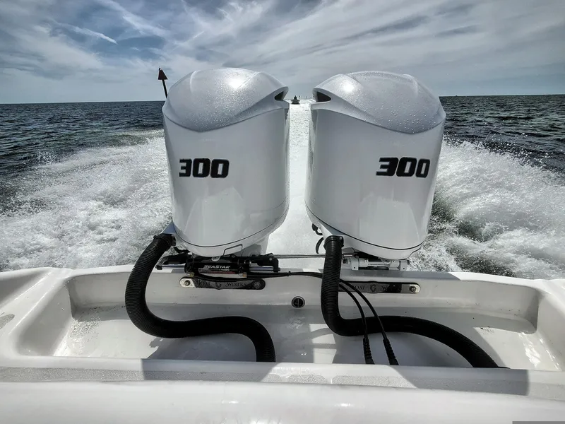 Slide: The Image of Twin 300 horsepower engines on a 2022 CG Boat Works 35 M-Series in action. - 47