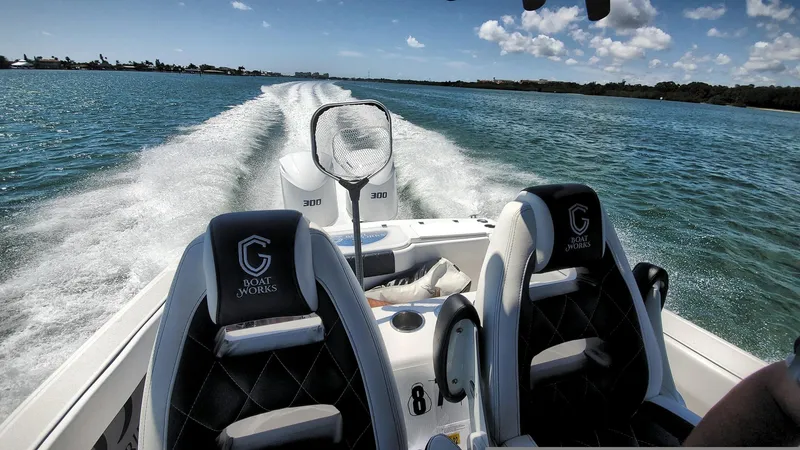 Slide: The Image of 2022 CG Boat Works 35 M-Series cruising on open water, leaving a wake behind. - 48