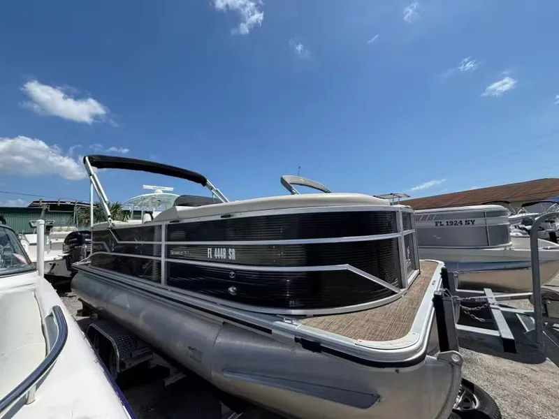 Slide: The Image of 2019 Cypress Cay Sea Breeze 212 pontoon boat under clear blue sky. - 1