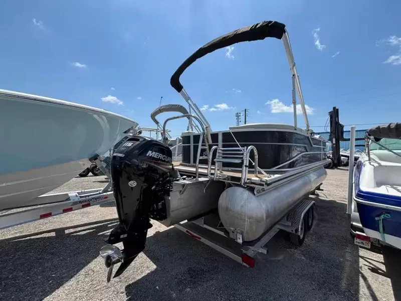 Slide: The Image of 2019 Cypress Cay Sea Breeze 212 pontoon boat with Mercury outboard motor, parked on trailer. - 10