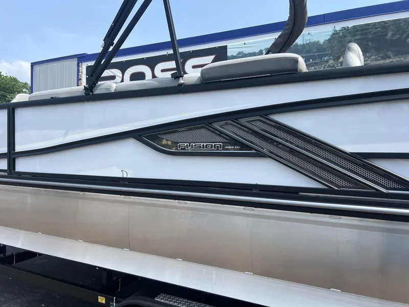 Slide: The Image of 2025 SunCatcher Fusion 322 FC boat side view with sleek design and modern detailing. - 10