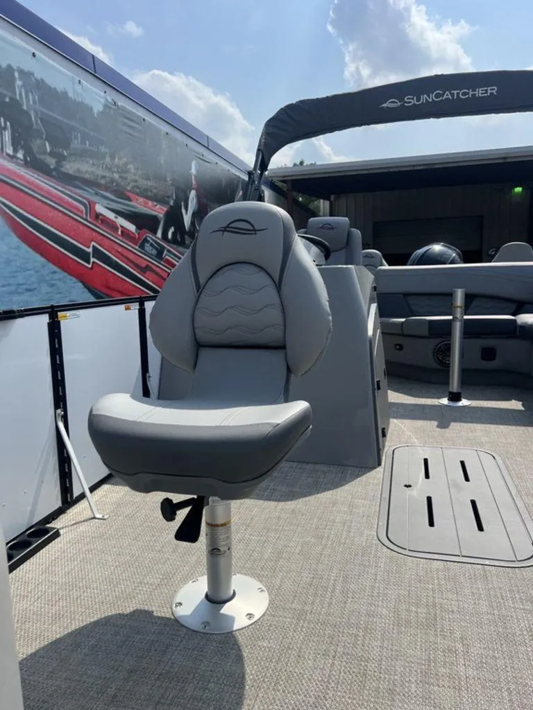 Slide: The Image of 2025 SunCatcher Fusion 322 FC boat interior with gray seating and canopy. - 14