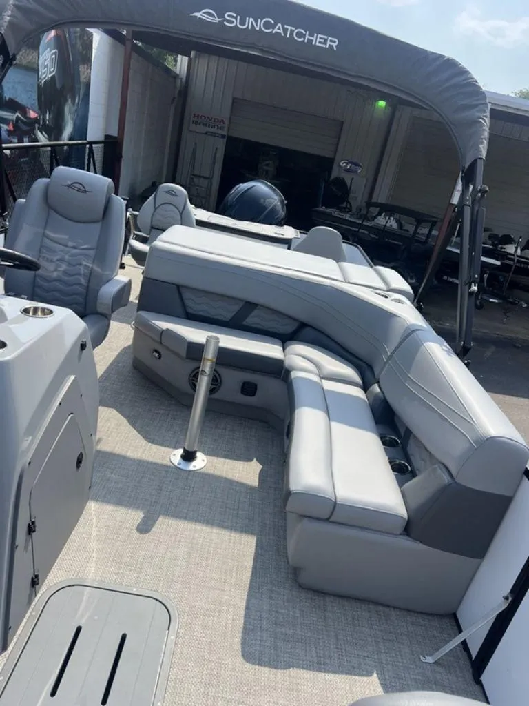 Slide: The Image of 2025 SunCatcher Fusion 322 FC pontoon boat with spacious seating and modern design. - 19