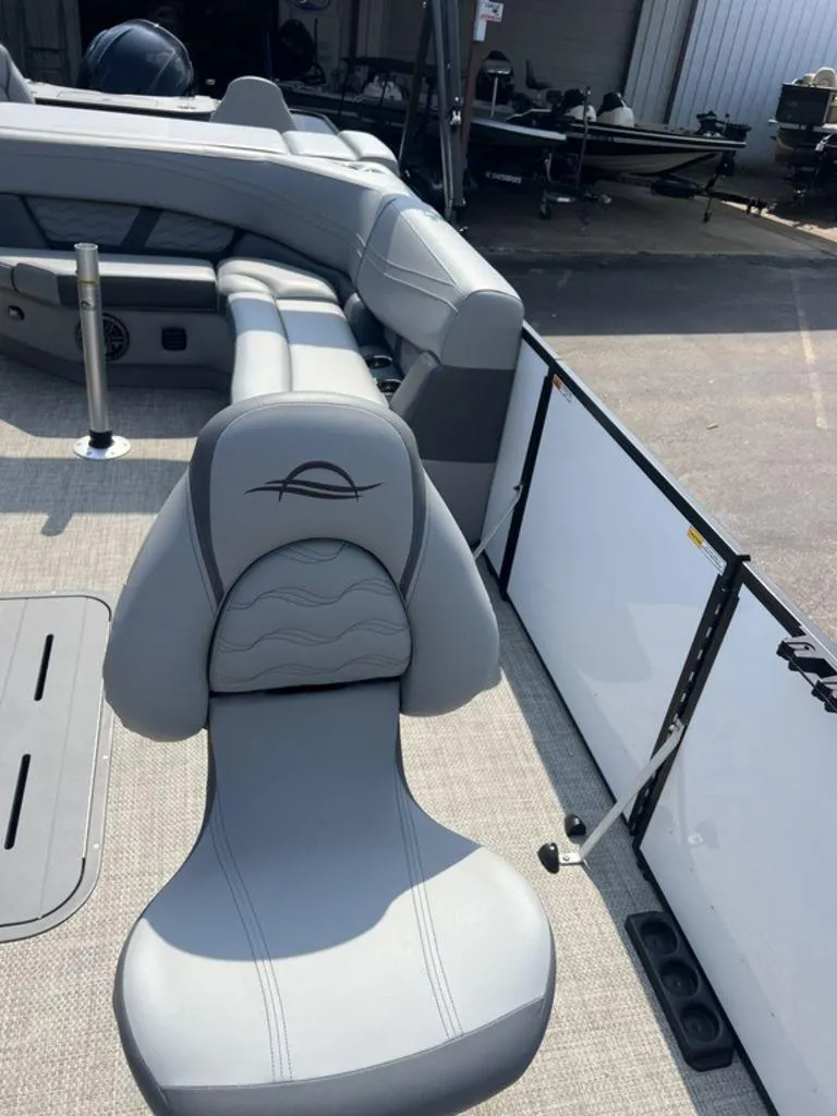 Slide: The Image of 2025 SunCatcher Fusion 322 FC boat interior with gray seating and modern design. - 21