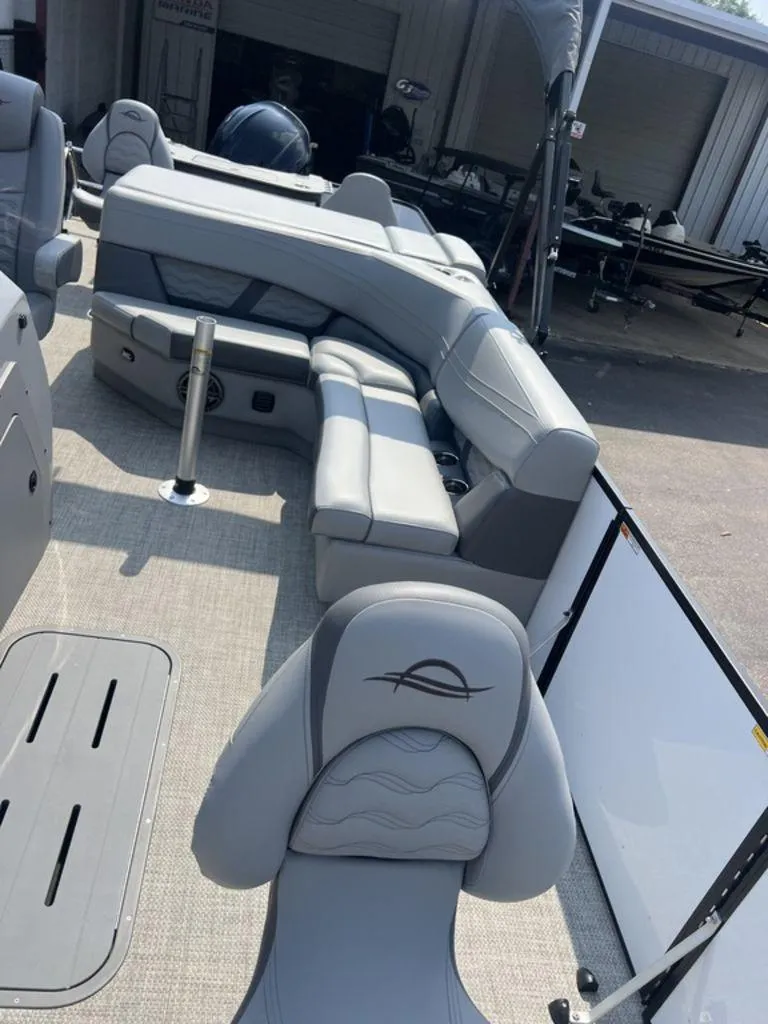 Slide: The Image of 2025 SunCatcher Fusion 322 FC boat interior with gray seating and modern design. - 22