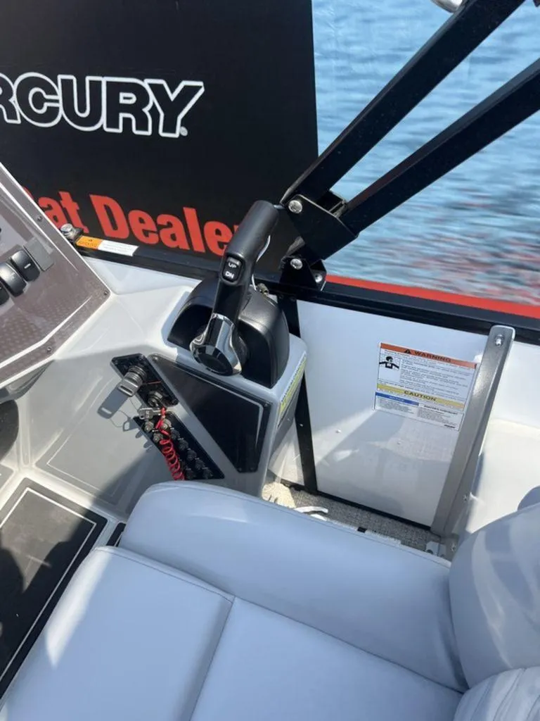 Slide: The Image of Interior of 2025 SunCatcher Fusion 322 FC boat with control panel and seating. - 29