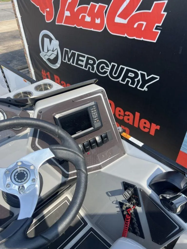 Slide: The Image of Steering console of 2025 SunCatcher Fusion 322 FC boat with Mercury branding. - 36