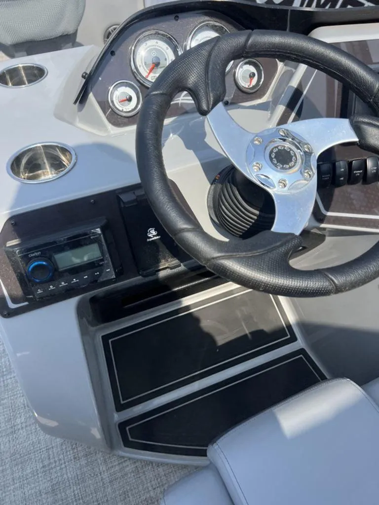 Slide: The Image of 2025 SunCatcher Fusion 322 FC dashboard with steering wheel and control panel. - 38