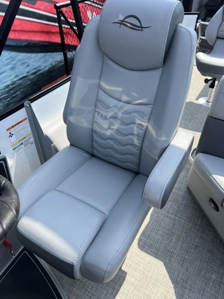 Slide: The Image of Luxury seating on 2025 SunCatcher Fusion 322 FC boat, featuring sleek gray upholstery. - 39