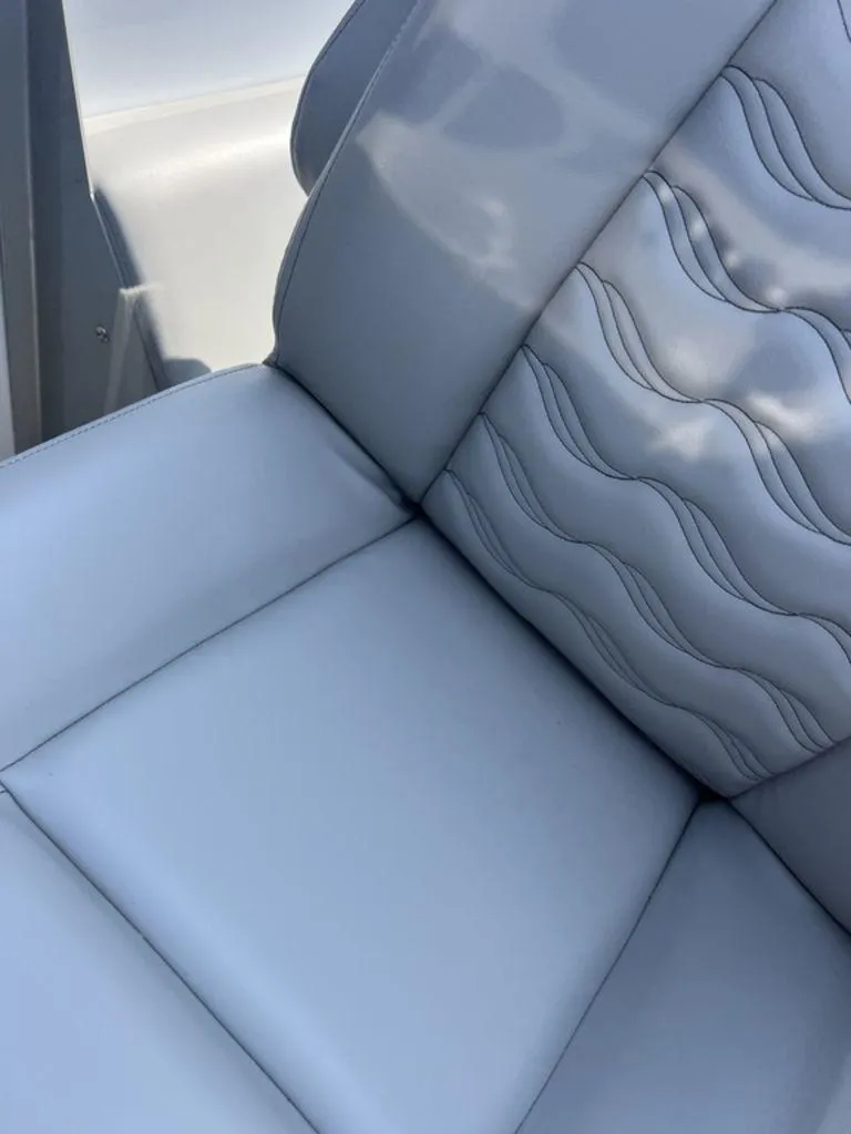 Slide: The Image of Luxurious seating on 2025 SunCatcher Fusion 322 FC boat with elegant wave pattern design. - 41