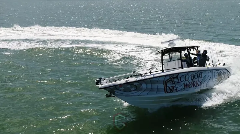 Slide: The Image of 2022 CG Boat Works 35 M-Series cruising on open water, showcasing speed and agility. - 18