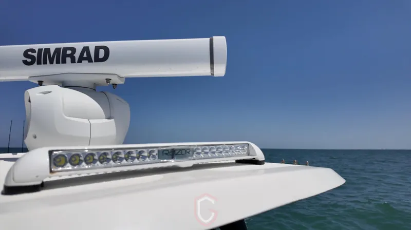 Slide: The Image of 2022 CG Boat Works 35 M-Series with Simrad radar on open sea. - 24