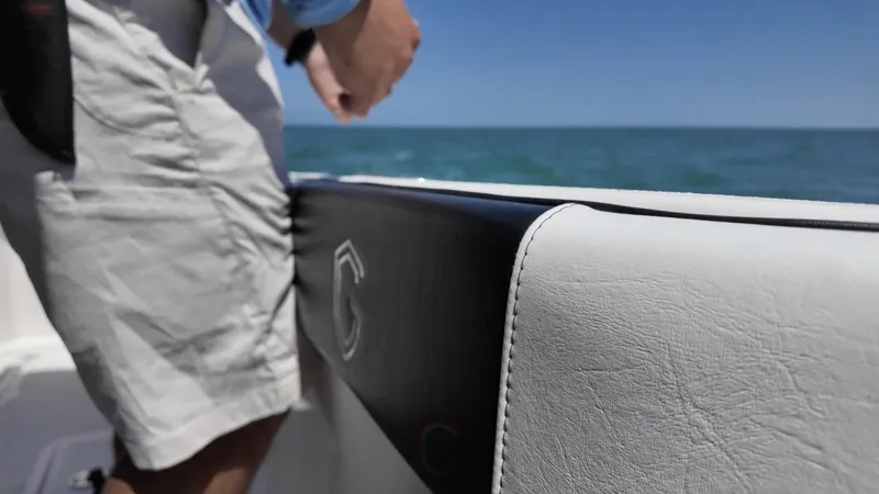 Slide: The Image of 2022 CG Boat Works 35 M-Series interior with ocean view and person standing. - 28