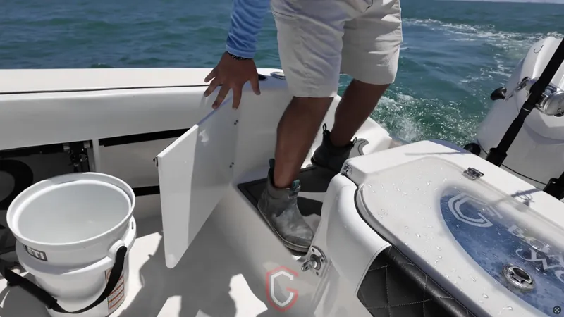 Slide: The Image of 2022 CG Boat Works 35 M-Series deck with storage access and fishing gear. - 35