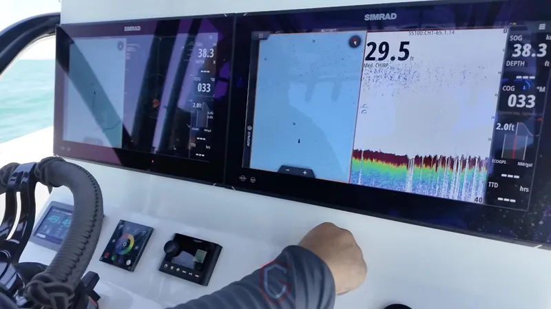 Slide: The Image of Control panel of 2022 CG Boat Works 35 M-Series with navigation screens and controls. - 40