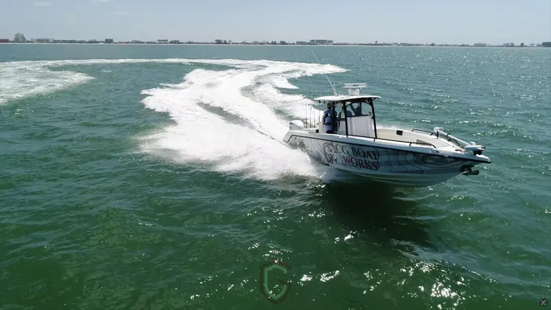 Slide: The Image of 2022 CG Boat Works 35 M-Series cruising on open water. - 42