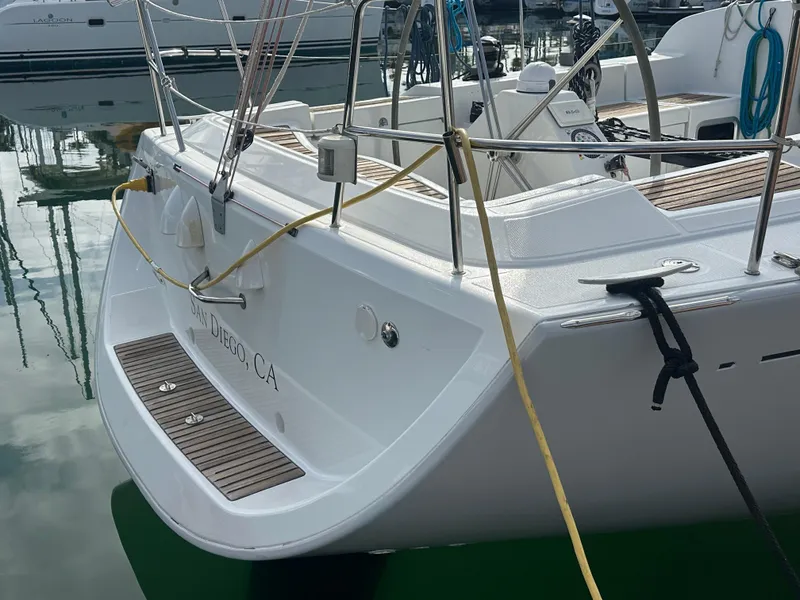 Slide: The Image of 2005 Beneteau First 44.7 sailboat docked, showcasing sleek design and spacious deck. - 10