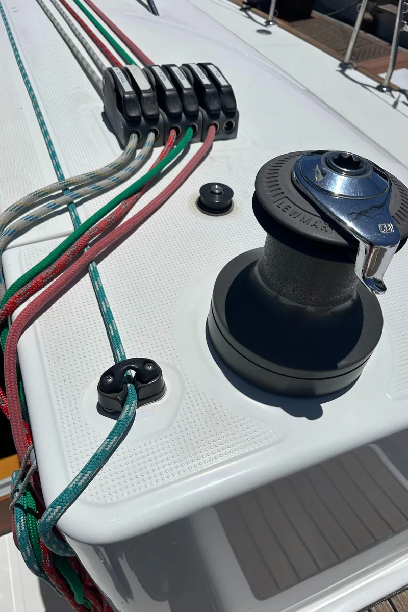 Slide: The Image of Deck of 2005 Beneteau First 44.7 sailboat with winch and colorful ropes. - 11