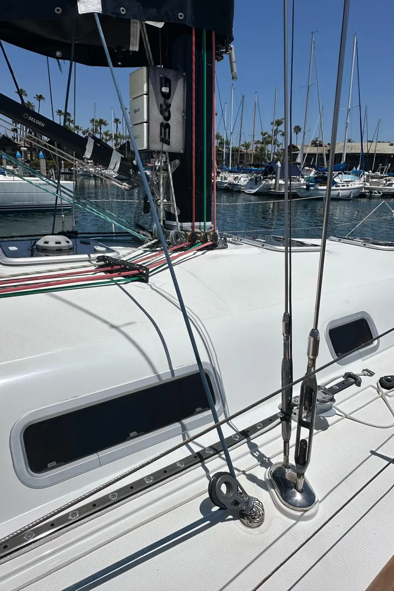 Slide: The Image of 2005 Beneteau First 44.7 sailboat deck with rigging, docked in a marina. - 12