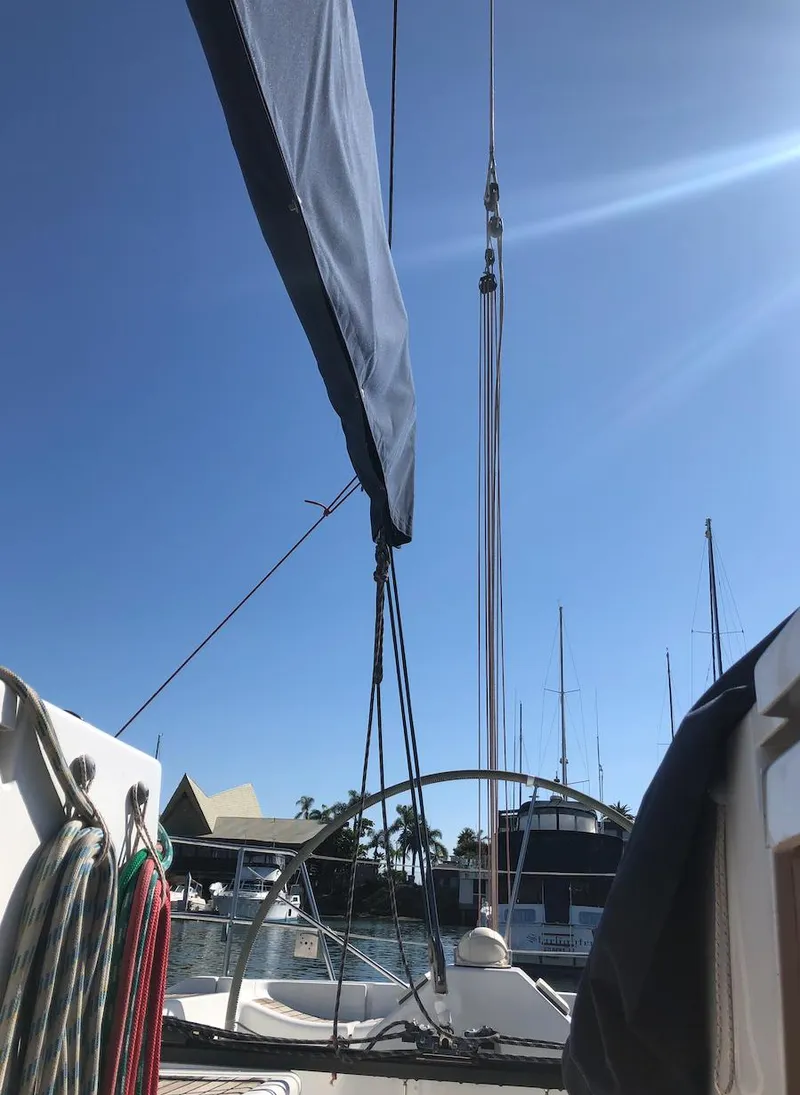 Slide: The Image of 2005 Beneteau First 44.7 sailboat deck view with rigging and clear blue sky. - 16