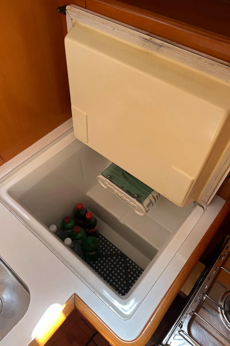 Slide: The Image of Beneteau First 44.7 (2005) yacht refrigerator with beverages inside. - 24