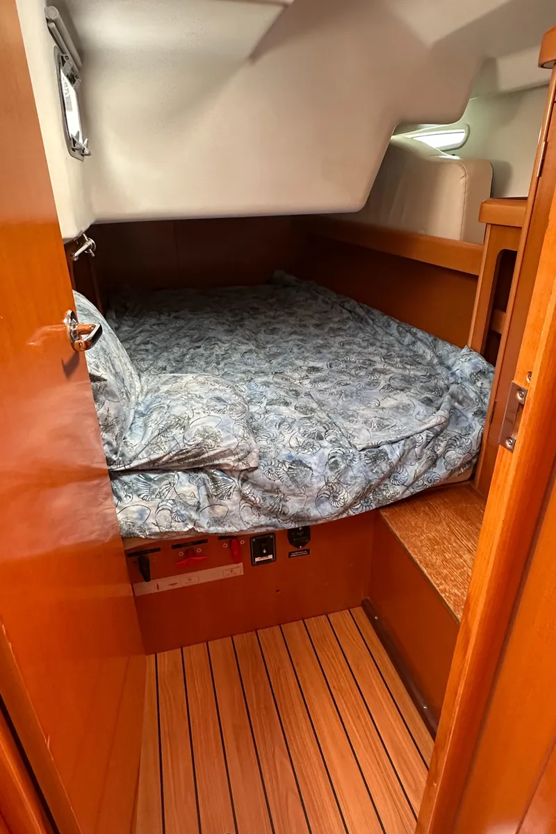 Slide: The Image of Cozy cabin interior of 2005 Beneteau First 44.7 sailboat with wooden flooring. - 25