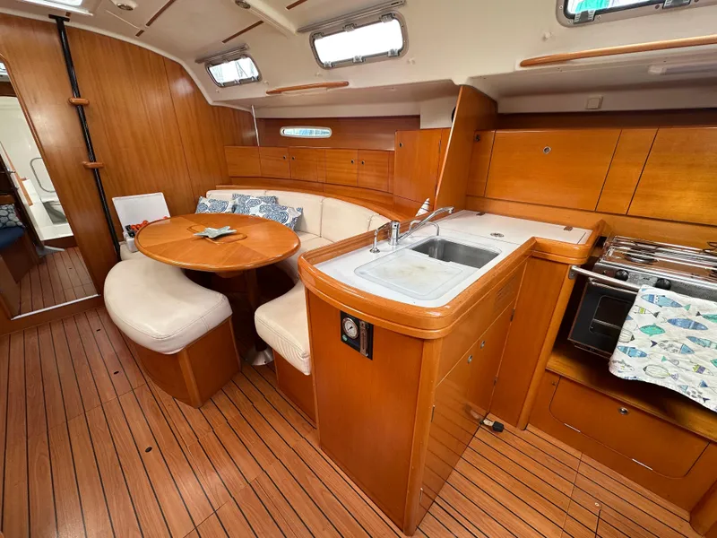 Slide: The Image of Luxurious 2005 Beneteau First 44.7 yacht interior with wood finish and modern amenities. - 26