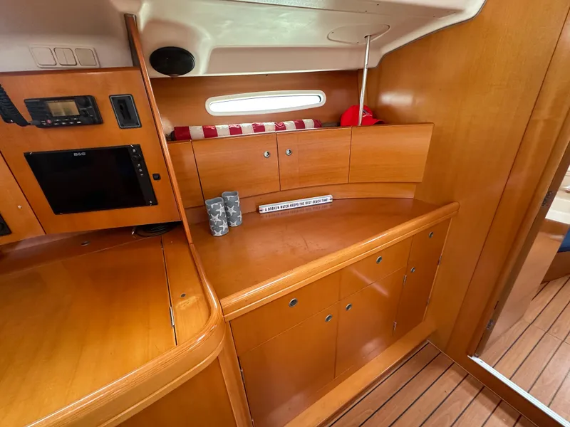Slide: The Image of Interior of 2005 Beneteau First 44.7 yacht with wooden cabinetry and modern amenities. - 27