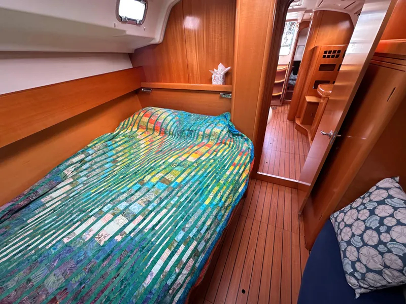 Slide: The Image of Cozy cabin interior of 2005 Beneteau First 44.7 sailboat with colorful bedding. - 29