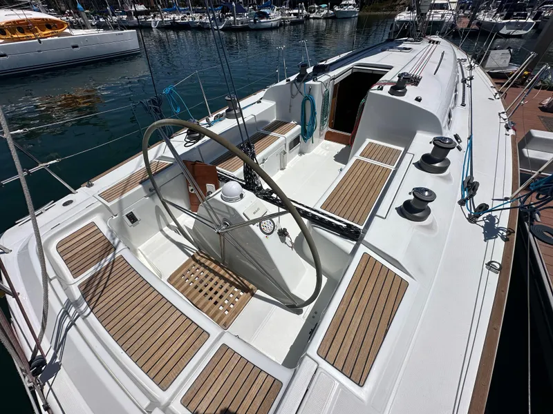 Slide: The Image of 2005 Beneteau First 44.7 sailboat cockpit with wooden deck and steering wheel. - 4
