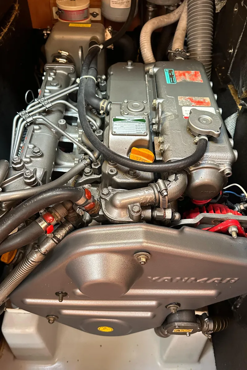 Slide: The Image of Engine of a 2005 Beneteau First 44.7 sailboat, showcasing detailed mechanical components. - 40