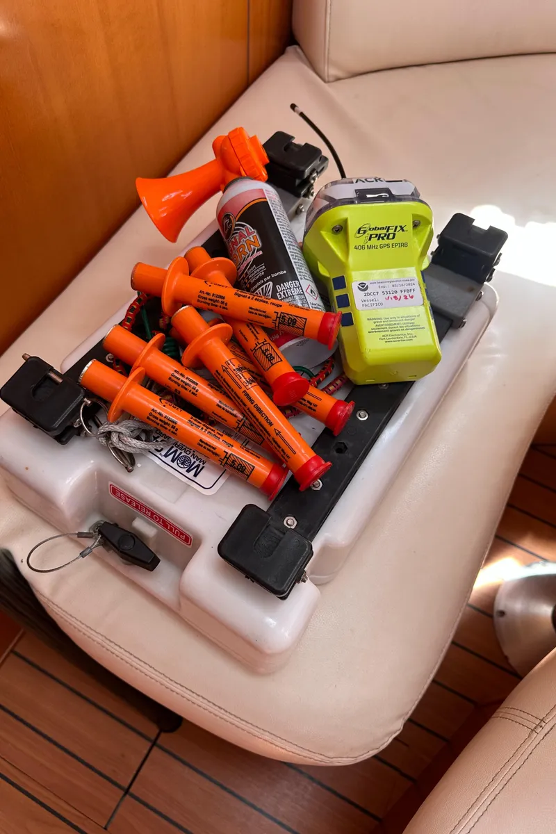 Slide: The Image of Safety equipment on Beneteau First 44.7 yacht, including flares and emergency devices, 2005 model. - 42