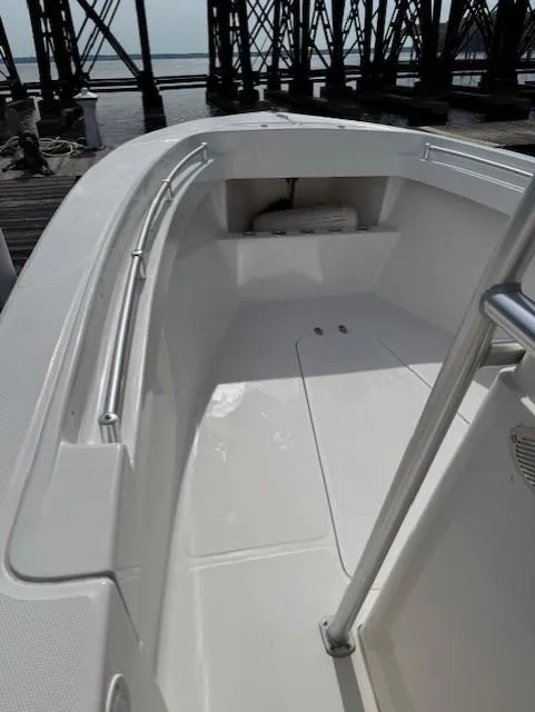 Slide: The Image of 2006 Angler 2600CC Limited Edition boat interior with sleek white deck and railing. - 10