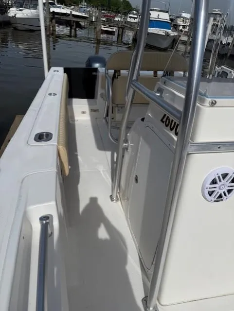 Slide: The Image of 2006 Angler 2600CC Limited Edition boat docked at a marina. - 12