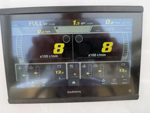 Slide: The Image of Garmin display on 2006 Angler 2600CC Limited Edition showing engine metrics and fuel data. - 21