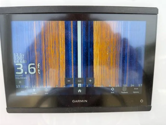 Slide: The Image of Garmin marine display showing sonar data on a 2006 Angler 2600CC Limited Edition boat. - 23