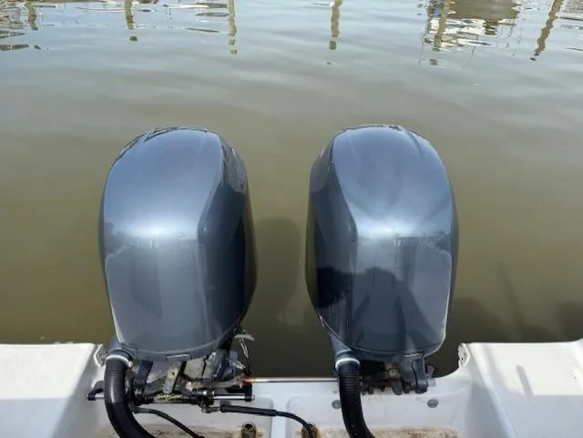 Slide: The Image of Twin outboard motors on a 2006 Angler 2600CC Limited Edition boat. - 26