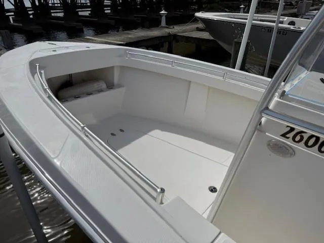 Slide: The Image of 2006 Angler 2600CC Limited Edition boat, spacious deck, docked at marina. - 3