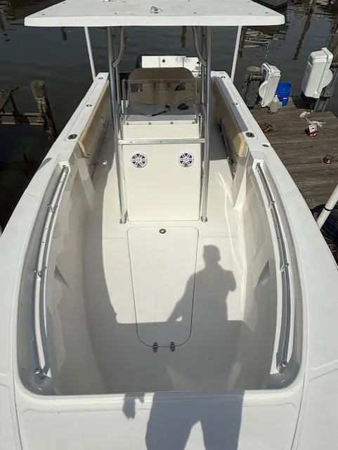 Slide: The Image of 2006 Angler 2600CC Limited Edition boat, white deck, docked at marina. - 6
